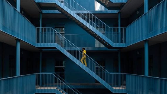 Young woman walking up stairs